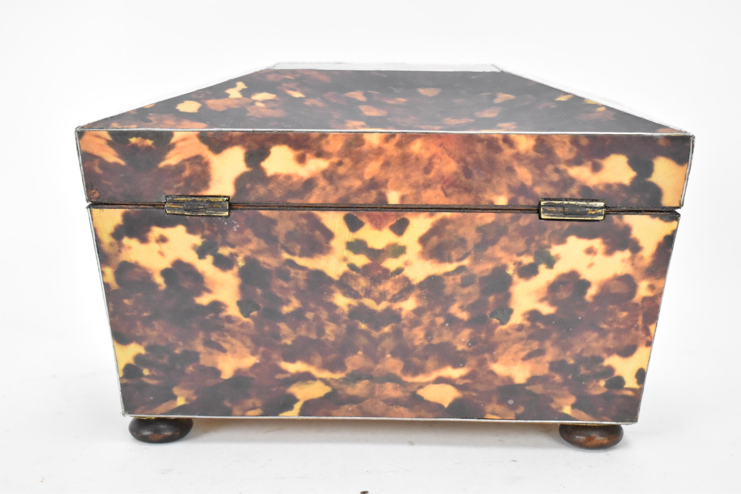 A late 20th century printed tortoiseshell pattern, twin compartment tea caddy, of sarcophagus form - Image 4 of 8