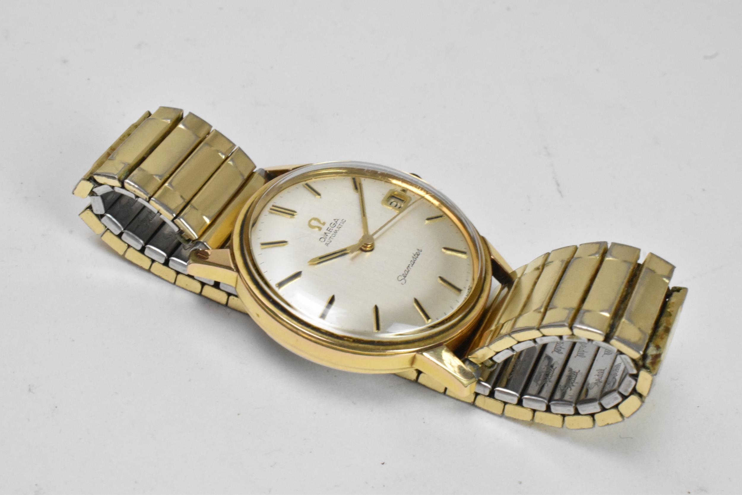 An Omega Seamaster, automatic, gents, gold plated wristwatch, having a silvered dial, centre - Image 4 of 9