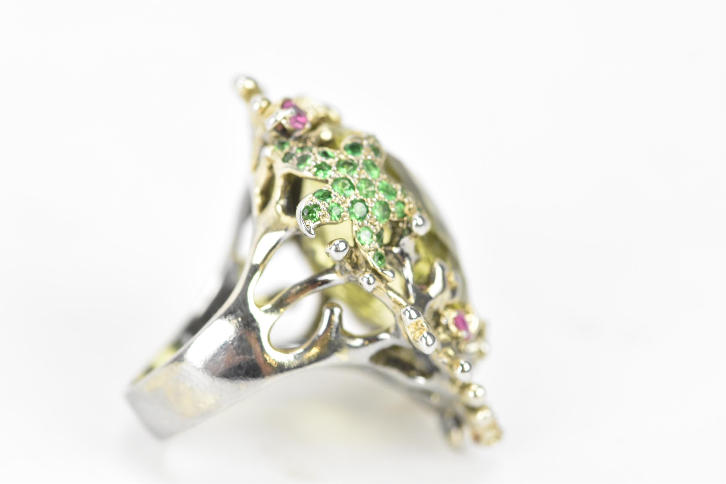 A silver dress ring inset with a large lemon quartz to the centre, decorated with a dolphin and - Image 3 of 3