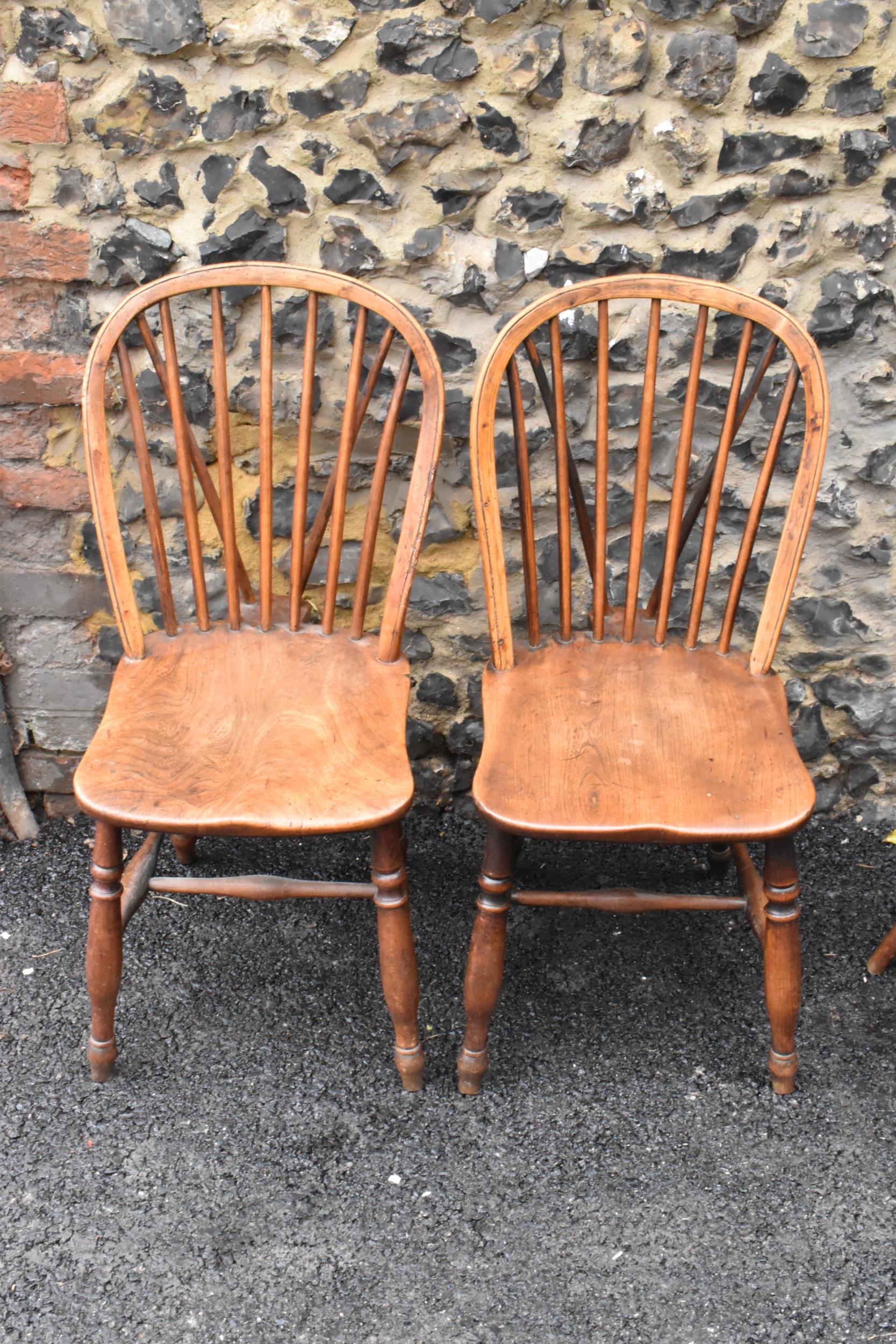 A set of four 19th century elm and ash Windsor dining chairs, having spindle hoop shaped backs, - Image 6 of 10