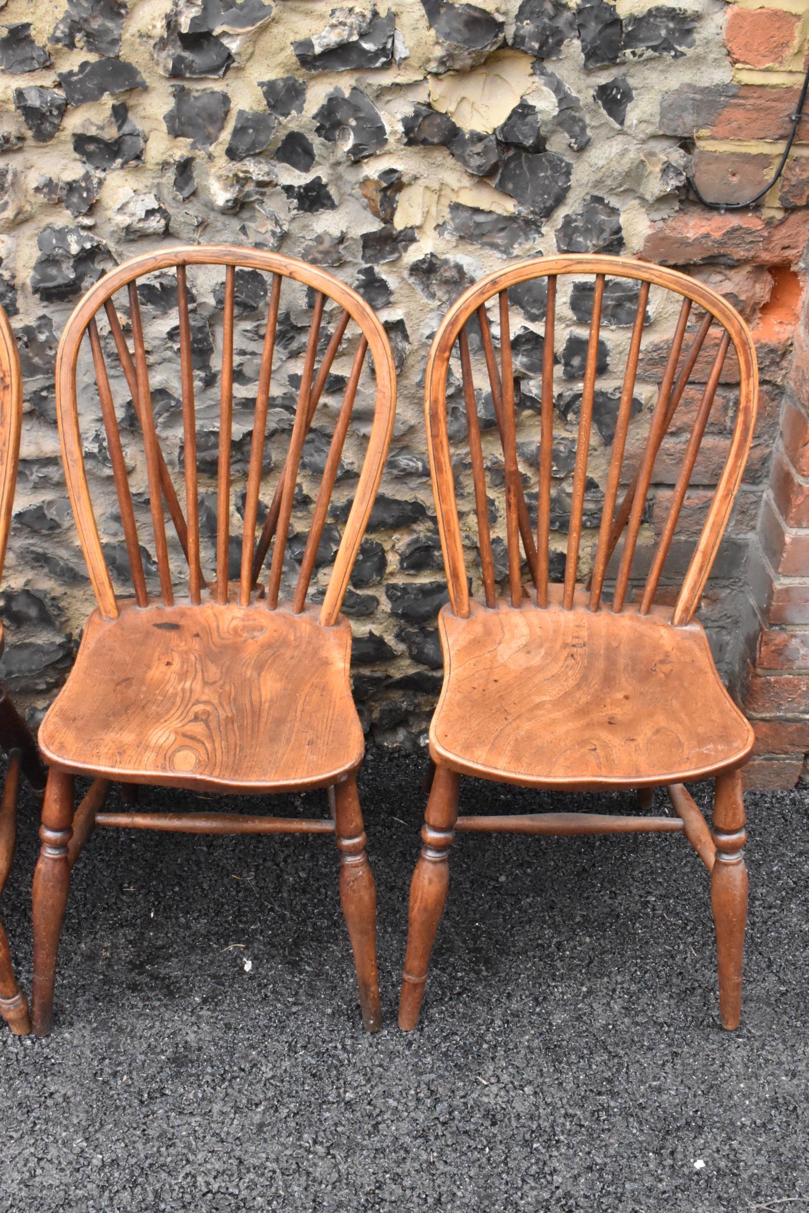 A set of four 19th century elm and ash Windsor dining chairs, having spindle hoop shaped backs, - Image 2 of 10