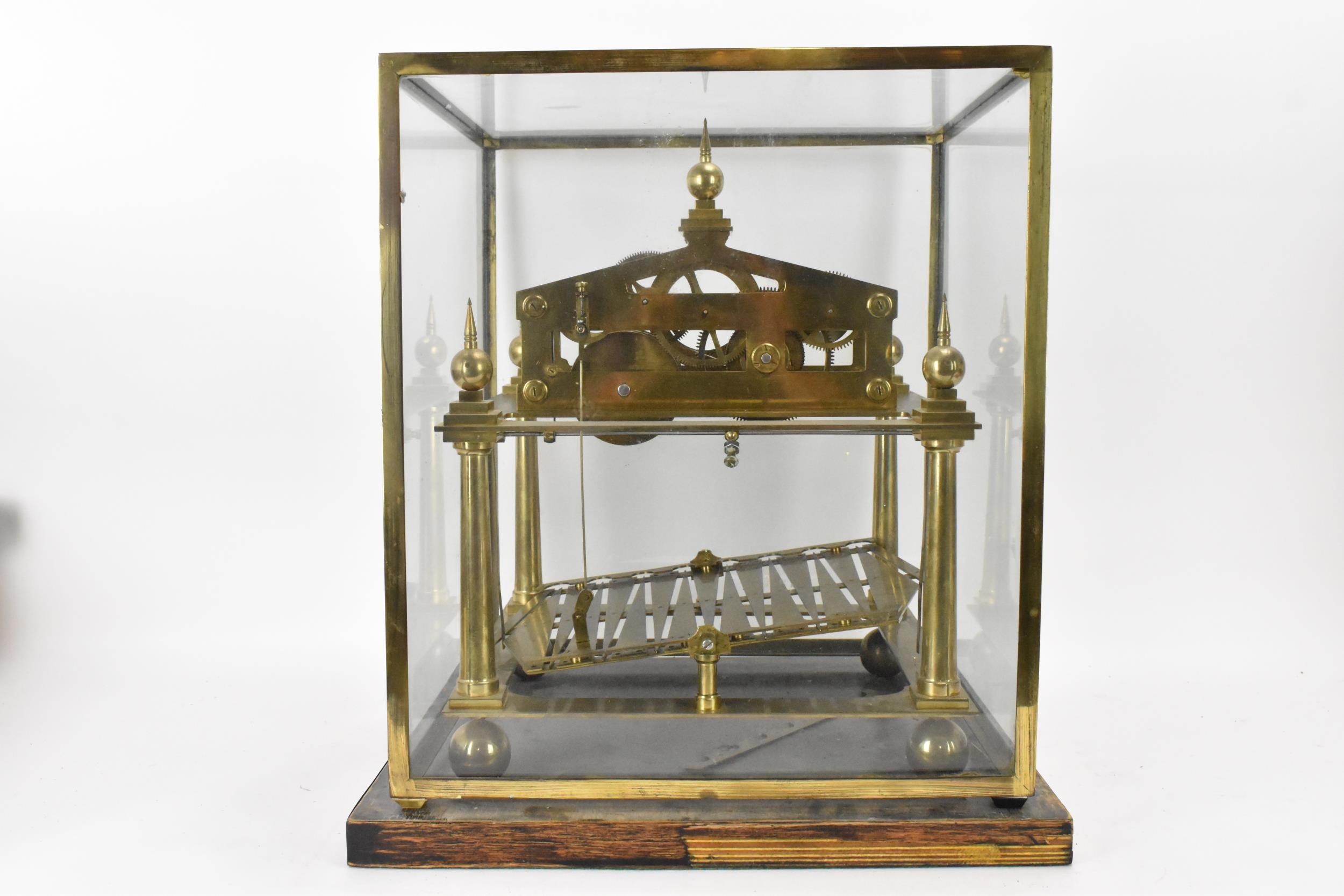A 20th century Congreve clock, housed in glass display cabinet, having three silvered chapter rings, - Image 3 of 7