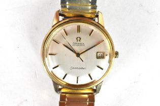 An Omega Seamaster, automatic, gents, gold plated wristwatch, having a silvered dial, centre