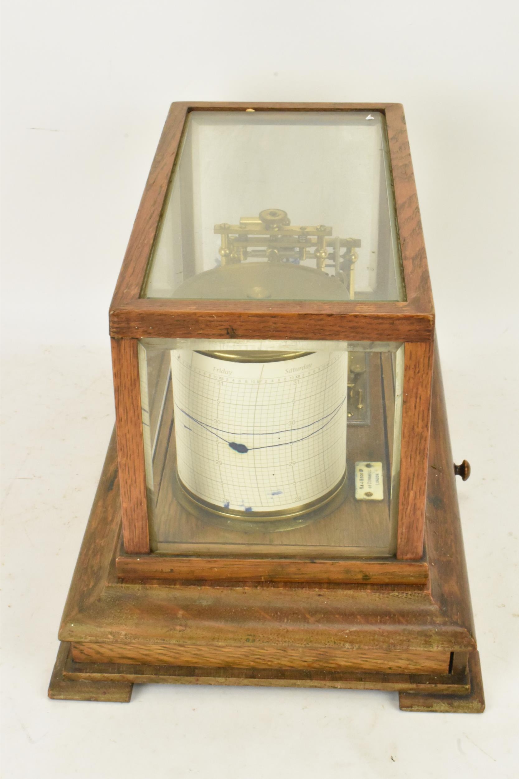 An early 20th century barograph, the oak case with bevelled glass and chart drawer, labelled 'J Beck - Image 4 of 7