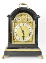 A late 19th century Winterhalder & Hofmeier ebonised mantle clock, the arched top case having cast