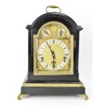 A late 19th century Winterhalder & Hofmeier ebonised mantle clock, the arched top case having cast