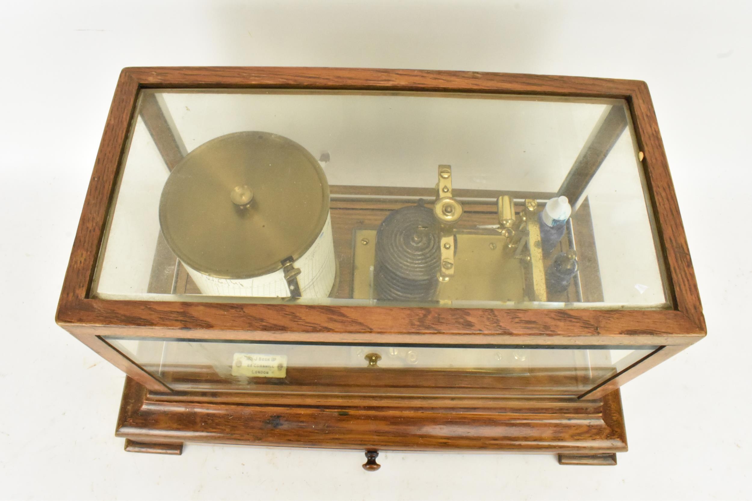 An early 20th century barograph, the oak case with bevelled glass and chart drawer, labelled 'J Beck - Image 3 of 7