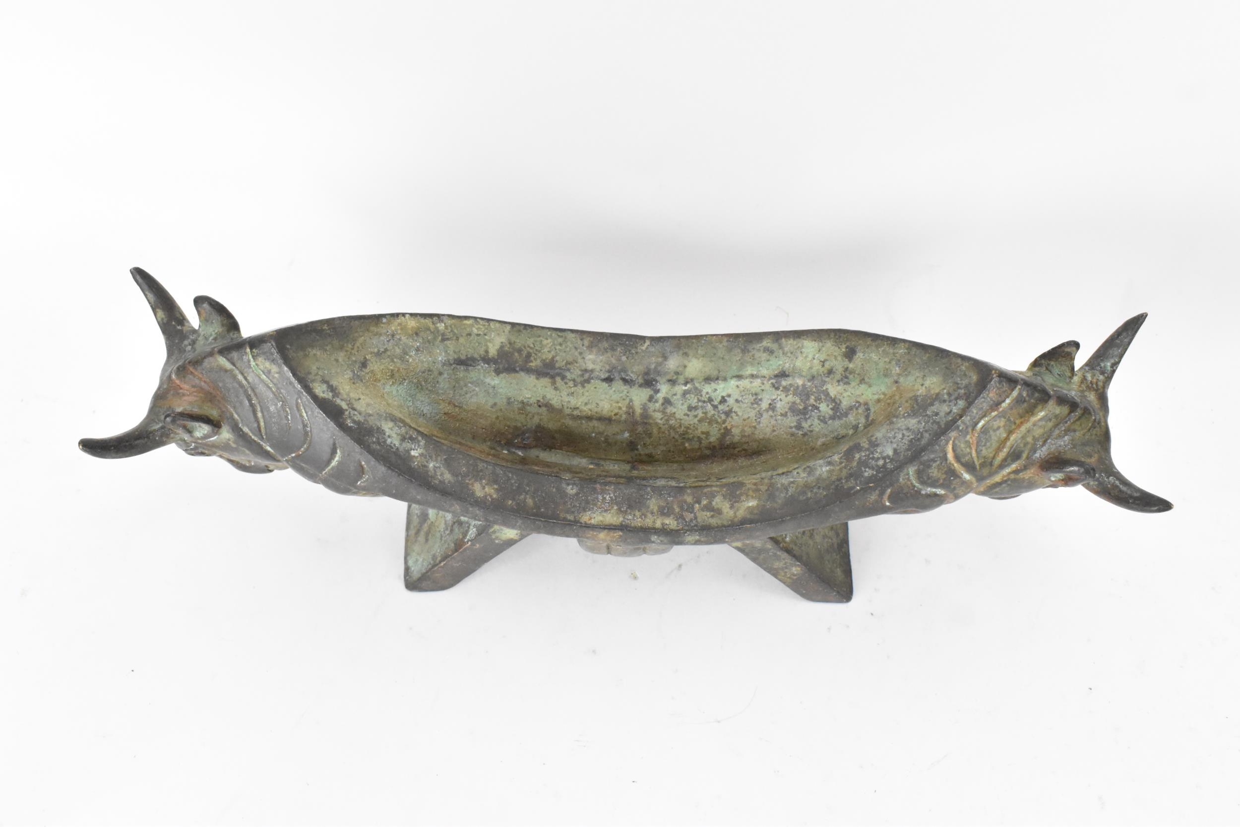 A 20th century Chinese patinated bronzed oblong shaped bowl, the sides fashioned as two bulls - Image 3 of 4