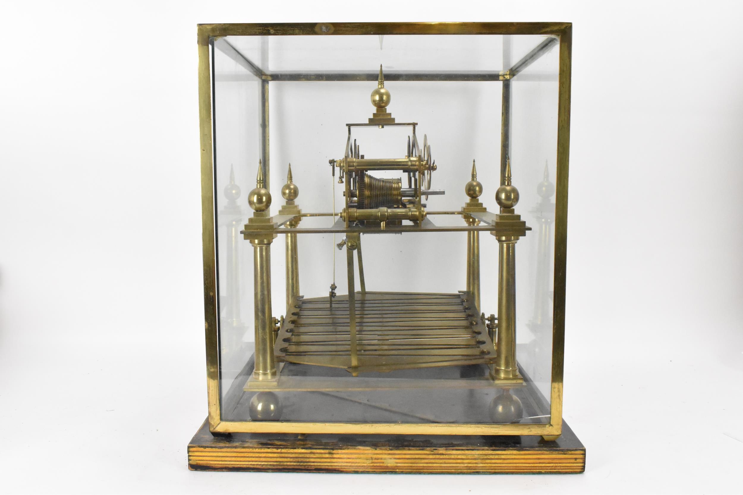 A 20th century Congreve clock, housed in glass display cabinet, having three silvered chapter rings, - Image 4 of 7