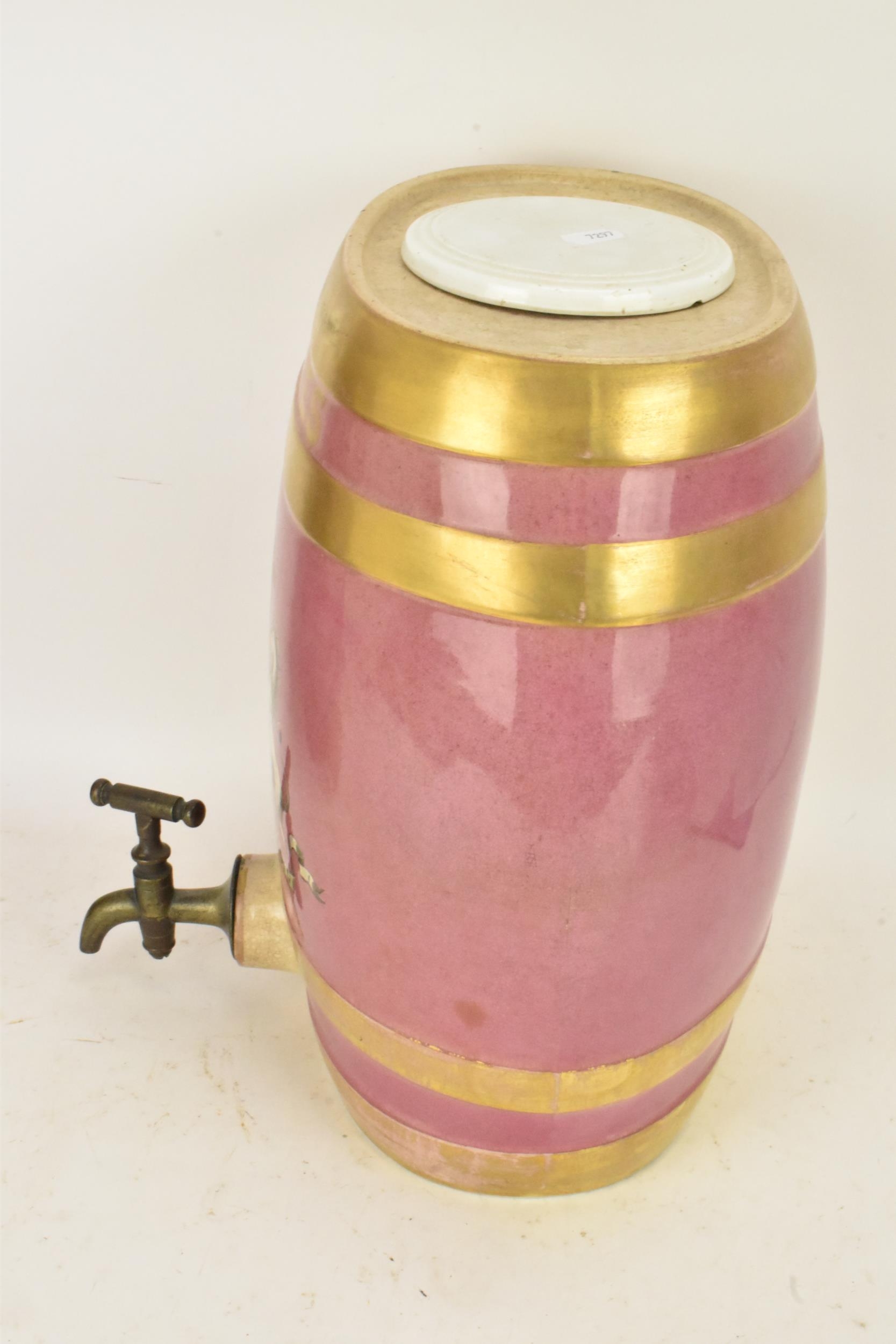 A Victorian ceramic cloves barrel, of oval shape and decorated with a pink ground with gilt bands - Image 2 of 6