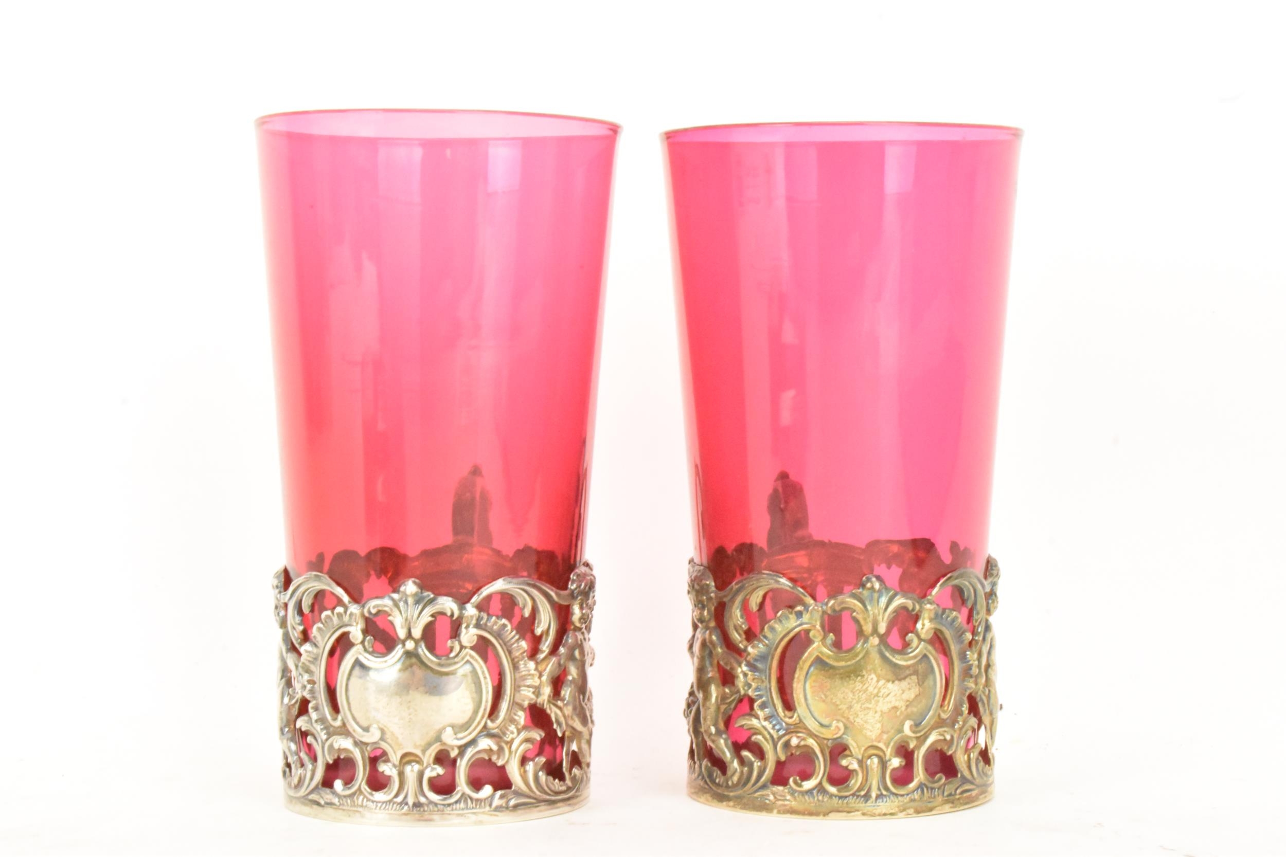 A pair of Edwardian silver glass holders with a pair of cranberry glasses, the holders ornately - Image 4 of 6