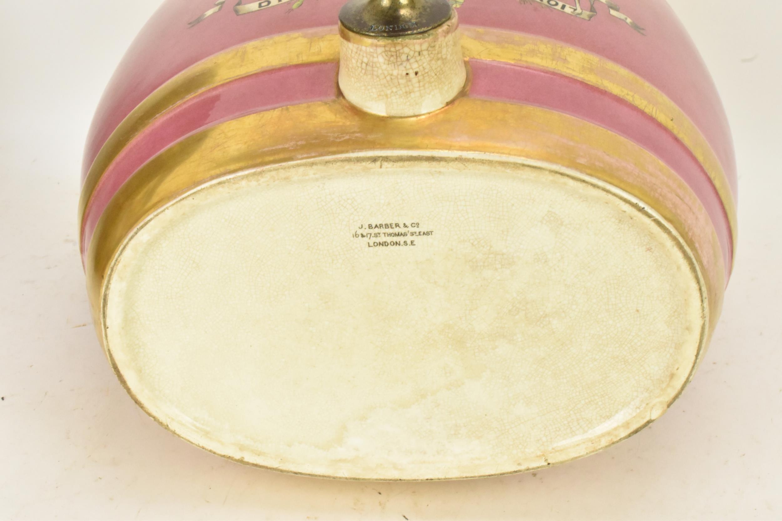 A Victorian ceramic cloves barrel, of oval shape and decorated with a pink ground with gilt bands - Image 6 of 6