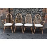 A set of four 1960s Ercol chairs blonde elm and beech 'Quaker' dining chairs, two being carvers,