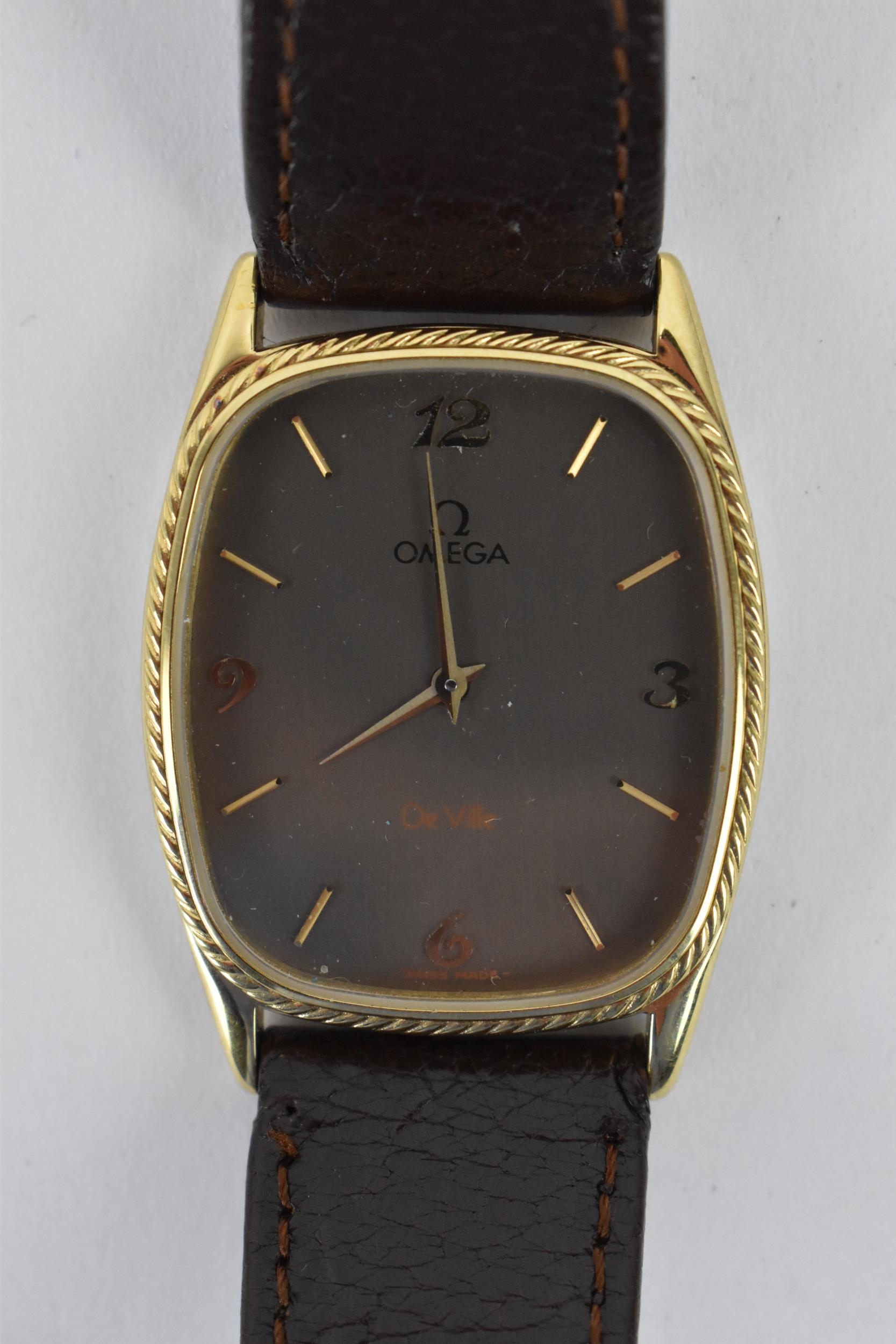 An Omega De Ville , quartz, gents, gold plated wristwatch, the dial having Arabic numerals and baton