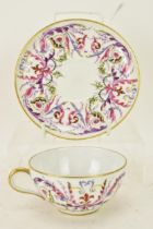 A mid 20th century French Le tallec hand painted cup and saucer, retailed by Tiffany & Co, decorated