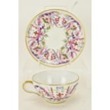 A mid 20th century French Le tallec hand painted cup and saucer, retailed by Tiffany & Co, decorated