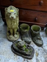 A group of weathered concrete garden ornaments / planters comprising a seated lion, pair of old