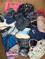 A quantity of High Street fashion bags to include a Hollister back-pack, a Cuby dog carrier, a