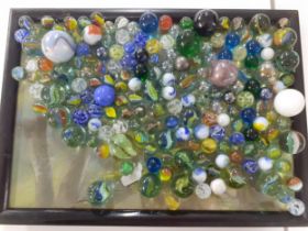 A small wooden box of vintage marbles mainly circa 1950s and a selection of polished stones.