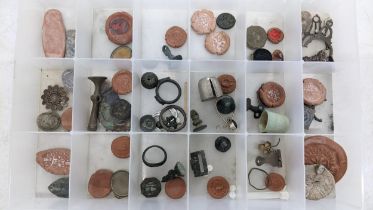 A selection of metal detector finds to include seal matrices jewellery including silver examples and