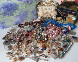 A quantity of vintage costume jewellery to include paste brooches A/F, bead necklaces A/F and semi