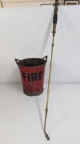 A vintage fire bucket, together with a brass eclipse sprayer lamp Location: