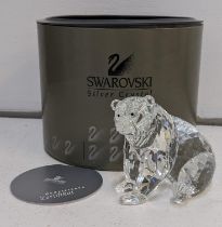 A boxed Swarovski model of a seated grizzly bear Location: