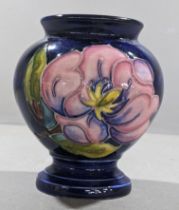 A Moorcroft baluster Magnolia pattern vase Location: