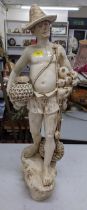 A Bretby large cream glazed boy with fishing pots and flagons, stamped 980 Location: