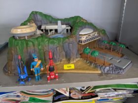 A Gerry Anderson toy model of the Thunderbirds Tracy Island with Thunderbird 1 & 3 and a figure (not