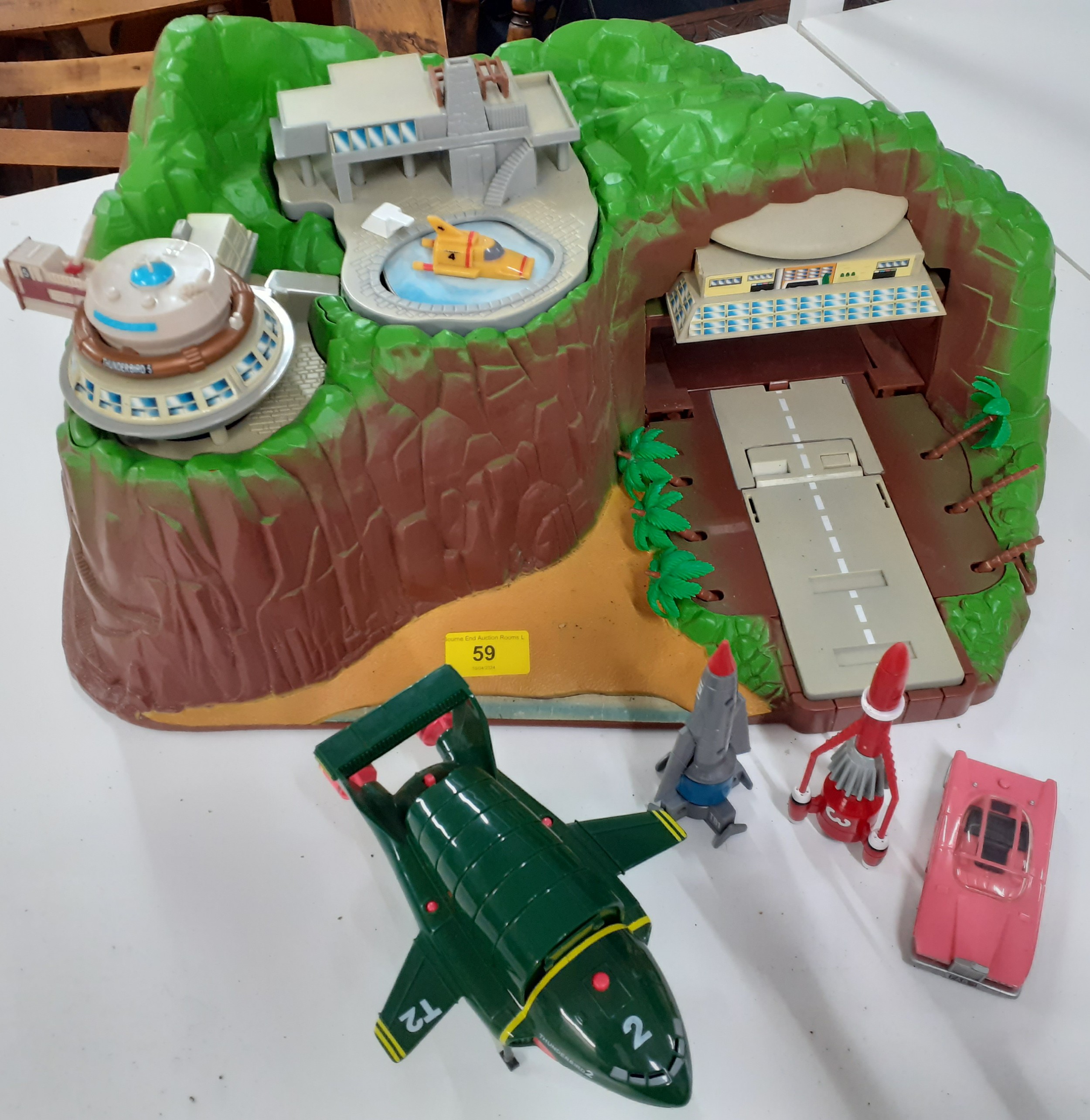 A Tracey Island toy with related accessories. Location: 1:4