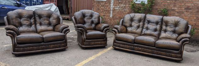 A Thomas Lloyd brown leather button back upholstered suite consisting of a three seater sofa, two