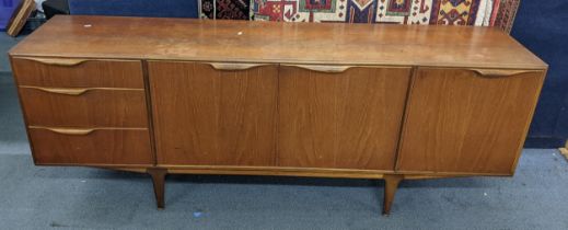 A mid 20th century McIntosh teak sideboard having a fall flap, two cupboards and three drawers, 76.