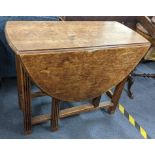 An early 20th century oak gateleg dining table, 72cm h x 89.5cm w Location: