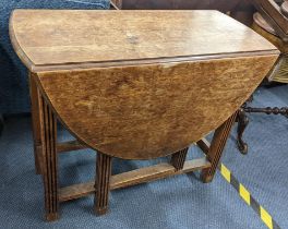 An early 20th century oak gateleg dining table, 72cm h x 89.5cm w Location: