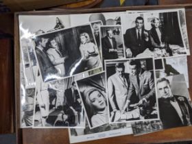 A collection of fifteen black and white publicity stills form various James Bond films to include