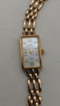 A 9ct gold ladies Rotary quartz wristwatch on a 9ct gold gate link bracelet, total weight 15.9g,