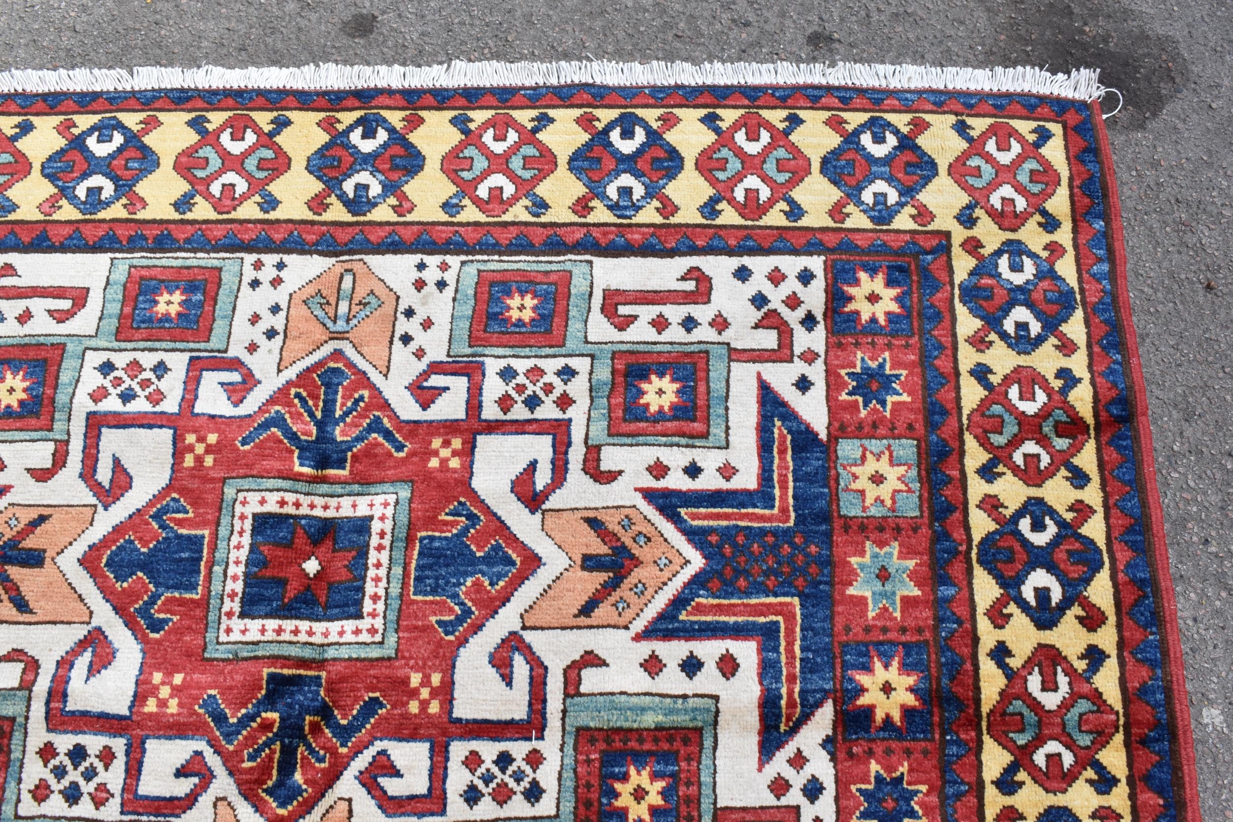 A handwoven Caucasian star kazak rug, having a geometric designs with repeating motifs, multiguard - Image 4 of 8