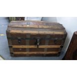 A Victorian domed top steamer trunk, canvas bound with wrought iron supports, 52cm h x 83cm w