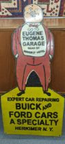 A late 20th century 'Eugene Thomas Garage' enamel advertising sign, 91cm x 44cm Location: