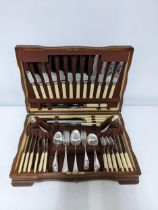 A mahogany veneered cased Arthur Price canteen of silver plated cutlery set with stimulated ivory