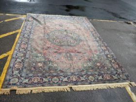A Persian Tabriz carpet, handwoven, floral pattern on a red ground, triple guard border and