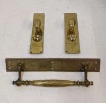 A large brass door handle an two later examples with plates Location: