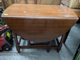 An early 20th century gateleg D-end table on turned legs united by square stretched 74 x 92 x 49 (