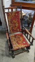 A late 19th century American walnut finished rocking chair with a carpet back and seat Location: G