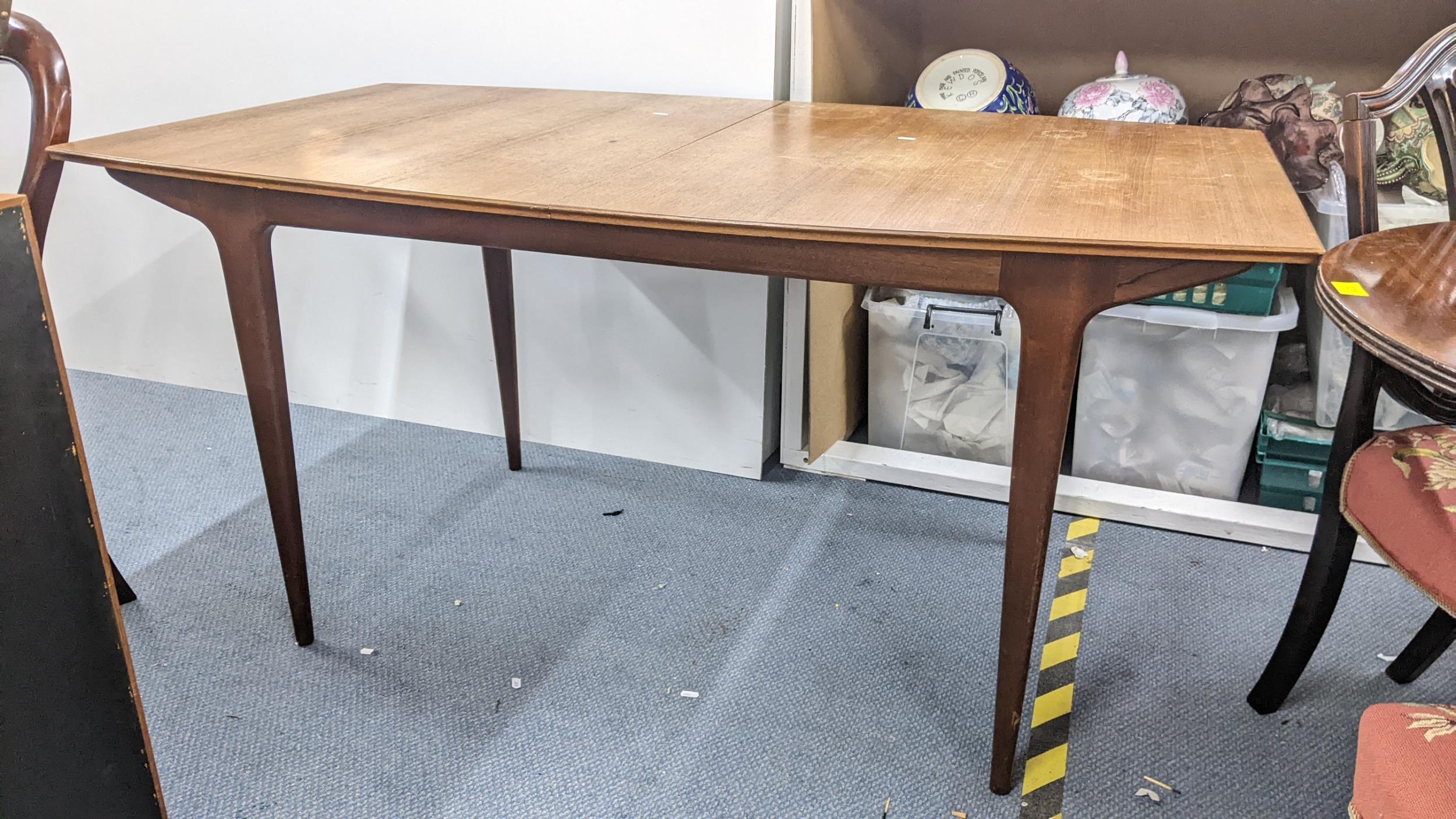 A mid 20th century McIntosh teak extending dining table, 73.5cm h x 152.5cm w, unextended Location: