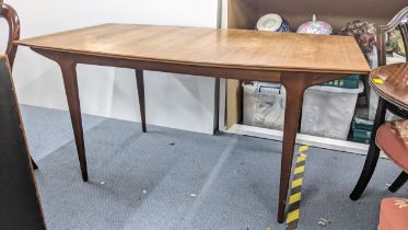 A mid 20th century McIntosh teak extending dining table, 73.5cm h x 152.5cm w, unextended Location: