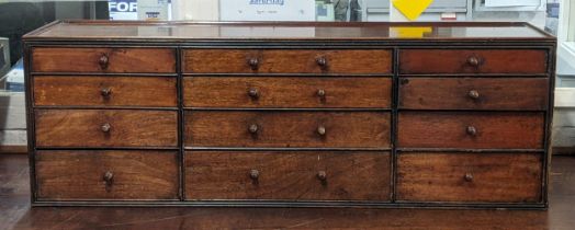 A 19th century mahogany collectors/chemists chest with twelve short drawers 31.5cm h x 93cm w