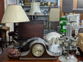 A mixed lot to include a plated drinks dispenser stand, two mantel clocks, a barley twist table