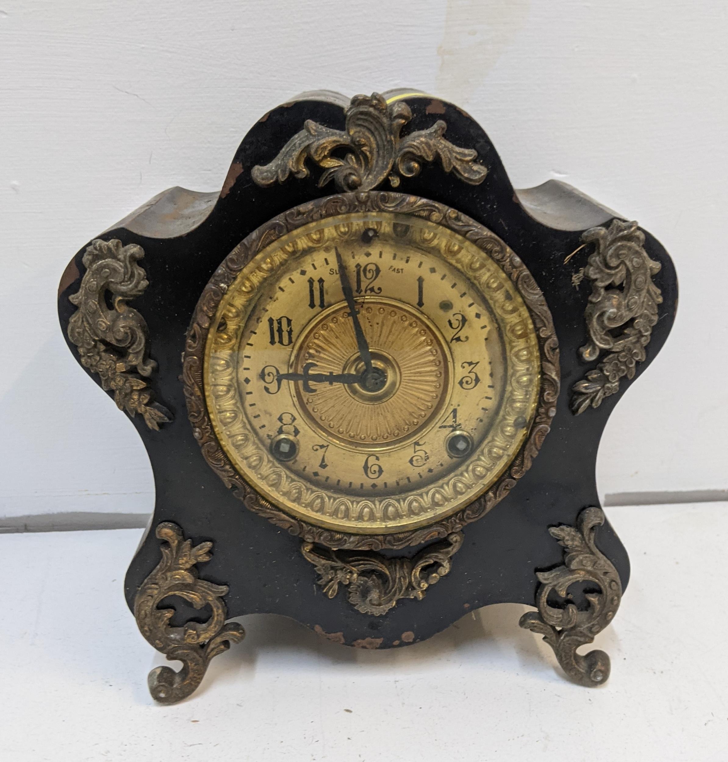 A late 19th century American black painted metal cased Ansonic mantle clock Location: